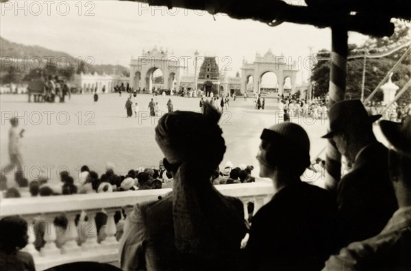 Procession for Dasara Festival. View from an audience stand of a procession taking place in front of the Mysore Palace gates during the Dasara Festival, a Hindu celebration to mark the triumph of Lord Rama over demon King Ravana. Mysore, India, 1933. Mysore, Karnataka, India, Southern Asia, Asia.