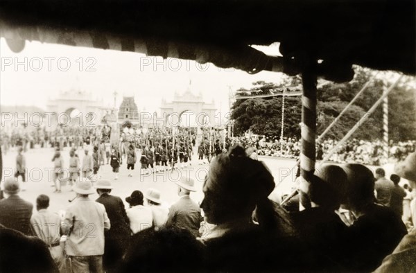 Procession for Dasara Festival. View from an audience stand of a procession taking place in front of the Mysore Palace gates during the Dasara Festival, a Hindu celebration to mark the triumph of Lord Rama over demon King Ravana. Mysore, India, 1933. Mysore, Karnataka, India, Southern Asia, Asia.