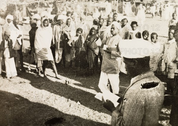 Evangelist preaching to villagers. Methodist evangelist R. Christadas preaches to a gathered crowd of Indian villagers. R. Christadas was accompanying British missionary Reverend Norman Sargant, who travelled throughout Mysore State preaching to rural Christian communities. Mysore State (Karnataka), India, 1933., Karnataka, India, Southern Asia, Asia.