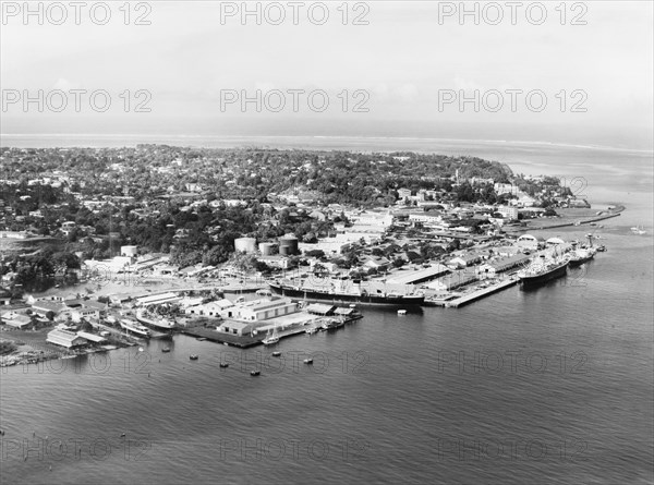 An aerial view of Suva, 1965. An aerial of Suva, the current Fijian capital, showing mostly the port and harbour facilities. Suva, Fiji, 1965 Suva, Viti Levu, Fiji, Pacific Ocean, Oceania.