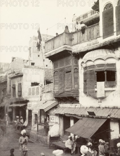 Street scene in Lahore. View of a shop-lined street in Lahore, taken from the back of an elephant. Lahore, India (Pakistan), February 1903. Lahore, Punjab, Pakistan, Southern Asia, Asia.