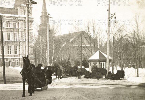 A horse-drawn sledge, Quebec. A horse-drawn sledge travels along a snow covered street in Quebec City. Quebec, Canada, February 1902. Quebec, Quebec, Canada, North America, North America .