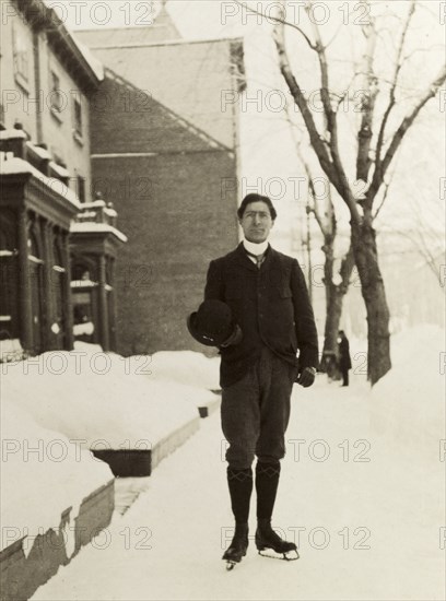 Mr Meagher ice skating, Montreal. Full-length portrait of Mr Meagher, who pauses for the camera whilst ice skating on the snow covered streets of Montreal. Montreal, Canada, February 1902. Montreal, Quebec, Canada, North America, North America .