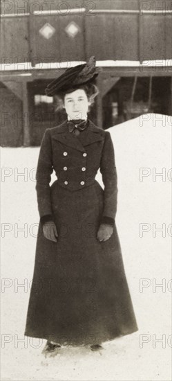 Annie Evan ice skating. Full-length portrait of Annie Evan, who pauses for the camera whilst ice skating on the snow covered streets of Montreal. Montreal, Canada, February 1902. Montreal, Quebec, Canada, North America, North America .