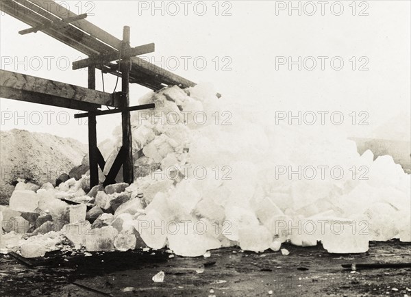 Freshly cut ice, Canada. A pile of ice freshly cut from Lake Ontario sits at the foot of a chute ready to be stored in an icehouse. Hamilton, Canada, February 1902. Hamilton, Ontario, Canada, North America, North America .
