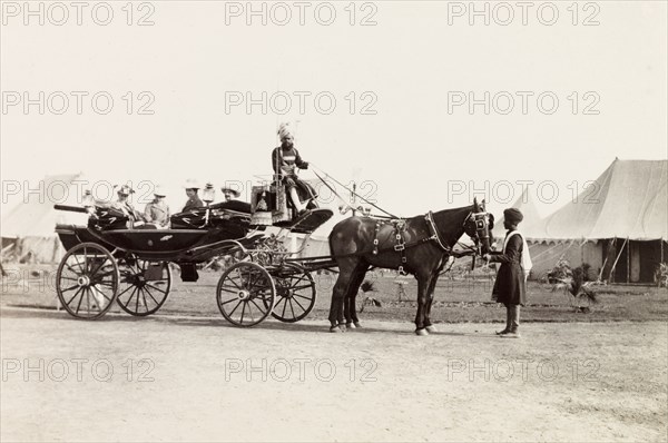 Dignitaries arriving for Delhi Durbar, 1903. European dignitaries arrive in an open horse-drawn carriage for the Coronation Durbar of Edward VII. Delhi, India, circa 1 January 1903. Delhi, Delhi, India, Southern Asia, Asia.