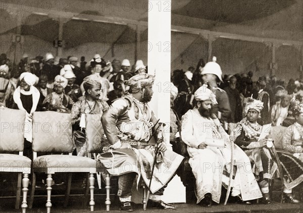 Maharajah of Baroda at Coronation Durbar, 1903. Sayajirao Gaekwad III, Maharajah of Baroda, sits with Indian dignitaries in the stalls of a pavilion to watch the celebrations of the Coronation Durbar. Delhi, India, 1 January 1903. Delhi, Delhi, India, Southern Asia, Asia.