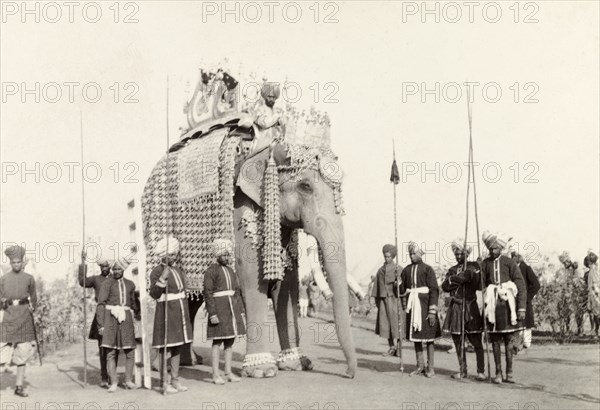The State Elephant of Patiala. The caparisoned state elephant of Patiala carries an ornate howdah on its back as it takes part in the state entry procession at the Coronation Durbar. An original caption comments that it was the largest state elephant in India, reaching a height of 18 feet. Delhi, India, circa 1 January 1903. Delhi, Delhi, India, Southern Asia, Asia.