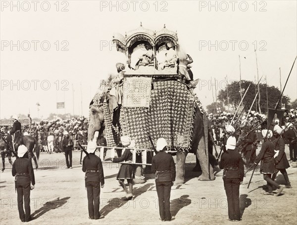 Maharajah of Patiala on state elephant, 1903. The Maharajah of Patiala travels inside an ornate howdah on the back of the state elephant during the entry procession at the Coronation Durbar. An original caption comments that it was the largest state elephant in India, reaching a height of 18 feet. Delhi, India, circa 1 January 1903. Delhi, Delhi, India, Southern Asia, Asia.