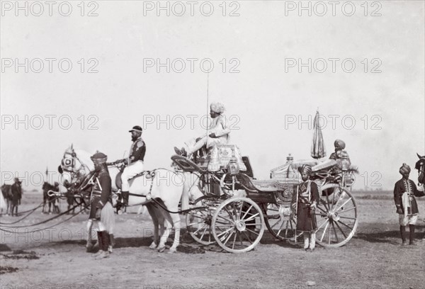 State carriage of Patiala, 1903. A team of white horses pull the ornate, silver state carriage of Patiala during a procession at the Coronation Durbar. Delhi, India, circa 1 January 1903. Delhi, Delhi, India, Southern Asia, Asia.
