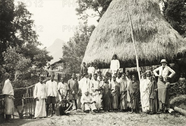 Methodist baptism ceremony, India. British missionary Reverend Norman Sargant poses with his congregation after performing a Methodist baptism at a coffee plantation. Emmekhan, Mysore State (Karnataka), India, circa 1937., Karnataka, India, Southern Asia, Asia.