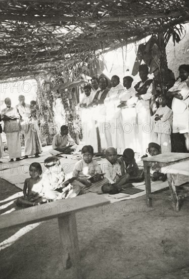 Night school at 'Maskal Maradi' estate. Children attend a night school class at a Methodist mission school at the 'Maskal Maradi' coffee plantation. Chikmagalur, Mysore State (Chikkamagaluru, Karnataka), India, circa 1937., Karnataka, India, Southern Asia, Asia.
