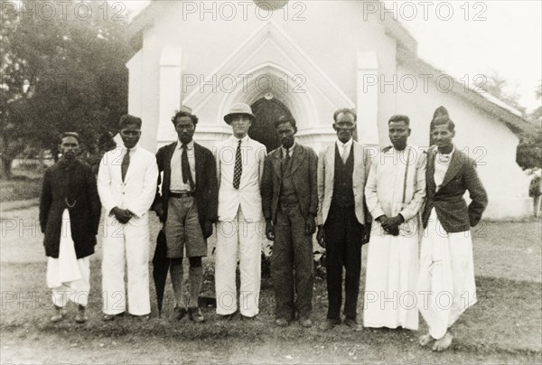 Reverend and staff of Chikmagalur Church. Group portrait of Reverend Norman Sargant (centre) posing with the staff of Chikmagalur Methodist Church. Chikmagalur, Mysore State (Chikkamagaluru, Karnataka), India, 1938., Karnataka, India, Southern Asia, Asia.