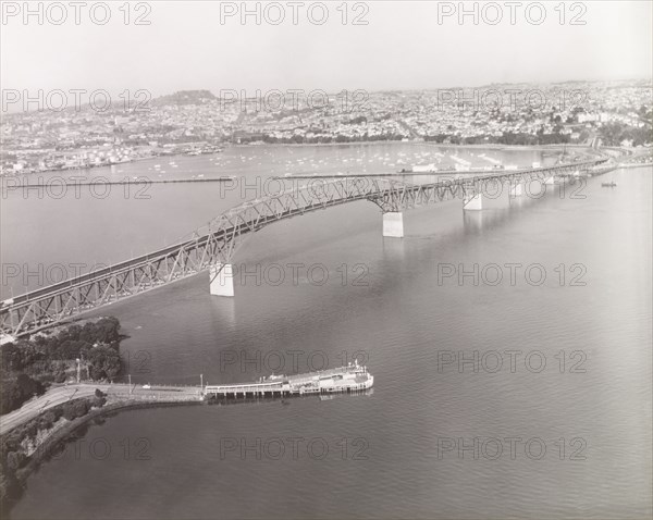 Auckland Harbour Bridge, 1966. Auckland Harbour Bridge stretches across Waitemata Harbour towards Auckland city. Auckland, New Zealand, 1966. Auckland, Auckland, New Zealand, New Zealand, Oceania.