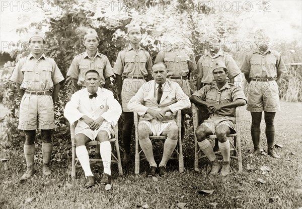Trainee health officers at Keningau Health Centre. Group portrait of British medical officer Dr Tregarthen with the first trainee health officers to attend Keningau Health Centre. The centre provided training for health officers in new hygiene and sanitation practices. Keningau, North Borneo (Sabah, Malaysia), circa 1937. Keningau, Sabah (North Borneo), Malaysia, South East Asia, Asia.