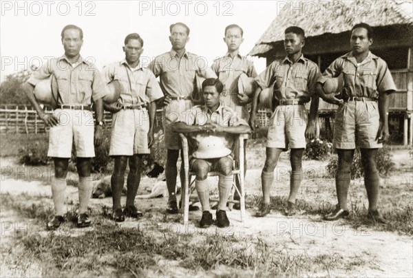Trainee health officers, North Borneo. Group portrait of the first trainee health officers to attend Keningau Health Centre. Health officers were trained by British medical officers at the centre to introduce new hygiene and sanitation practices to local villages. Keningau, North Borneo (Sabah, Malaysia), circa 1937. Keningau, Sabah (North Borneo), Malaysia, South East Asia, Asia.