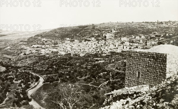 The village of Lifta, circa 1938. A twisting road winds its way down a hillside beneath the Arab village of Lifta. Lifta's proximity to the Jerusalem-Jaffa highway made it a strategic Zionist target and by February 1948, the village's Arab occupants had been displaced: their homes, businesses and farms destroyed. Lifta near Jerusalem, British Mandate of Palestine (Israel), circa 1938. Lifta, Jerusalem, Israel, Middle East, Asia.