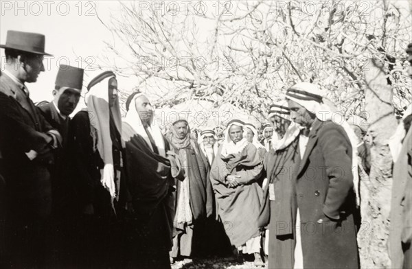 William Ryder McGeagh talks to Arab villagers. William Ryder McGeagh (left), District Commissioner in Jerusalem, talks to a group of Arab men whilst visiting a rural Arab village. British Mandate of Palestine (Israel), circa 1940. Israel, Middle East, Asia.