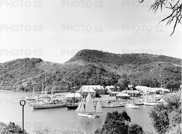 View over English Harbour. Various types of sail boat are moored at English Harbour, the site of an 18th century Royal Navy base where Vice Admiral Horatio Nelson was stationed as a young Captain. English Harbour, Antigua, 1965. English Harbour, St Paul (Antigua and Barbuda), Antigua and Barbuda, Caribbean, North America .