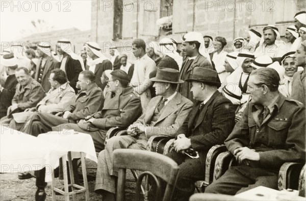 Recruitment meeting at Al Faluja. William Ryder McGeagh (third from right), District Commissioner in Jerusalem, attends a military recruitment meeting in the Arab village of Al Faluja. Al Faluja, British Mandate of Palestine (South Israel), 1944., South (Israel), Israel, Middle East, Asia.