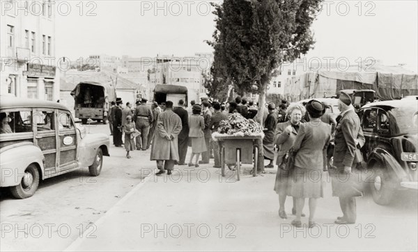 Leaving Jerusalem, April 1948. Palestinian Arabs from the residential district of Qatamon gather on Julian's Way (today King David Street) as they prepare to leave their homes during the 1948 Arab-Israeli War. Jerusalem, British Mandate of Palestine (Israel), April 1948. Jerusalem, Jerusalem, Israel, Middle East, Asia.