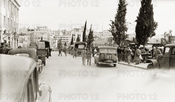 Leaving Jerusalem, April 1948. Palestinian Arabs from the residential district of Qatamon gather on Julian's Way (today King David Street) as they prepare to leave their homes during the 1948 Arab-Israeli War. Jerusalem, British Mandate of Palestine (Israel), April 1948. Jerusalem, Jerusalem, Israel, Middle East, Asia.
