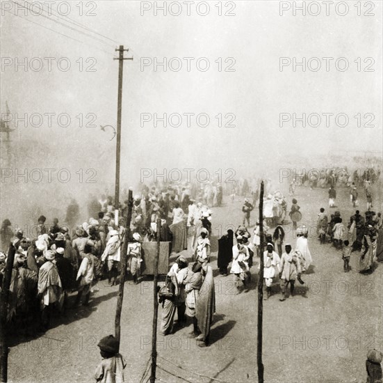 Pilgrims at the Ardh Kumbh Mela. Crowds of Hindu pilgrims line a procession route at the Ardh Kumbh Mela. Allahabad, United Provinces (Uttar Pradesh), India, January 1936. Allahabad, Uttar Pradesh, India, Southern Asia, Asia.