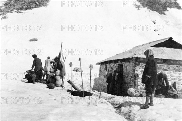 Equipment check on Sheshnag Mountain. A group of mountain guides organise their equipment at a camp on the upper slopes of Sheshnag Mountain. Jammu and Kashmir, India, 1934., Jammu and Kashmir, India, Southern Asia, Asia.