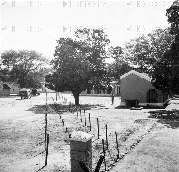 Indian Police compound in Aligarh. A barbed wire fence divides an Indian Police compound. Aligarh, United Provinces (Uttar Pradesh), India, 1938. Aligarh, Uttar Pradesh, India, Southern Asia, Asia.