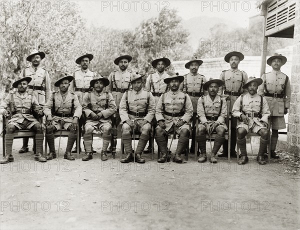 Asian officers of the Eighth Royal Gurkha Rifles. Asian officers of the Eighth Royal Gurkha Rifles pose for a group portrait, dressed in full uniform with marching canes. North West Frontier Province, India (Pakistan), 1920., North West Frontier Province, Pakistan, Southern Asia, Asia.