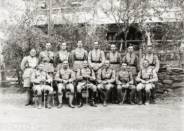 European officers of the Eighth Royal Gurkha Rifles. European officers of the Eighth Royal Gurkha Rifles pose for a group portrait, dressed in full uniform with walking sticks. North West Frontier Province, India (Pakistan), 1920., North West Frontier Province, Pakistan, Southern Asia, Asia.