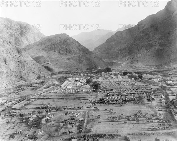 Military camp on the Khyber Pass. View across an Indian Army camp at Ali Masjid, located in a mountain valley on the Khyber Pass. Protected by earthworks and stone walls, the camp sits beneath 
a hilltop fort, and contains numerous bell tents, horses and carts. Ali Masjid, North West Frontier Province, India (Federally Administered Tribal Areas, Pakistan), 1919. Ali Masjid, Federally Administered Tribal Areas, Pakistan, Southern Asia, Asia.