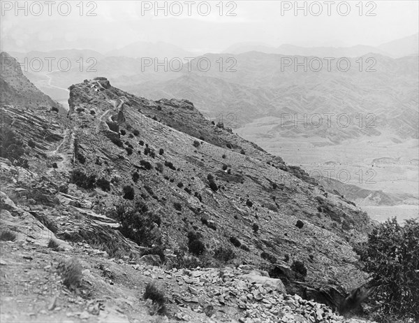A picquet overlooking the Khyber Pass. Two Indian Army bell tents mark the site of a military picquet overlooking a valley in the Khyber Pass. An original caption points out the remains of an old fort nearby and the Kabul River in the distance. Kafirkot, North West Frontier Province, India (Federally Administered Tribal Areas, Pakistan), 1919., Federally Administered Tribal Areas, Pakistan, Southern Asia, Asia.