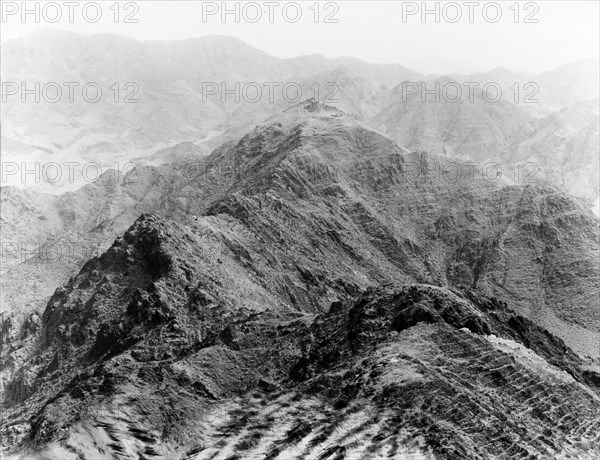Indian Army picquets in the Khyber Pass. Two Indian Army picquets sit strategically atop a mountain overlooking a valley in the Khyber Pass. North West Frontier Province, India (Federally Administered Tribal Areas, Pakistan), 1919., Federally Administered Tribal Areas, Pakistan, Southern Asia, Asia.
