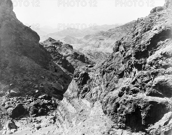 View of Landi Khana camp through the Jangi Gorge. Bell tents belonging to an Indian Army camp at Landi Khana are just visible in the distance through the mountainous Jangi Gorge in the Khyber Pass. Landi Khana, North West Frontier Province, India (Federally Administered Tribal Areas, Pakistan), 1919. Landi Khana, Federally Administered Tribal Areas, Pakistan, Southern Asia, Asia.