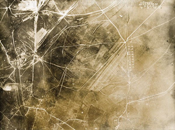 Aerial view of Achiet-le-Grand, 1918. One of a series of British aerial reconnaissance photographs recording the positions of trenches on the Western Front during the First World War. Roads and transport tracks criss-cross the village of Achiet-le-Grand, a British casualty clearing station and railhead, shortly before the village was reoccupied by the Germans during the Spring Offensive of 21-25 March 1918. Achiet-le-Grand, Nord-Pas de Calais, France, 18 March 1918. Achiet le Grand, Nord-Pas de Calais, France, Western Europe, Europe .