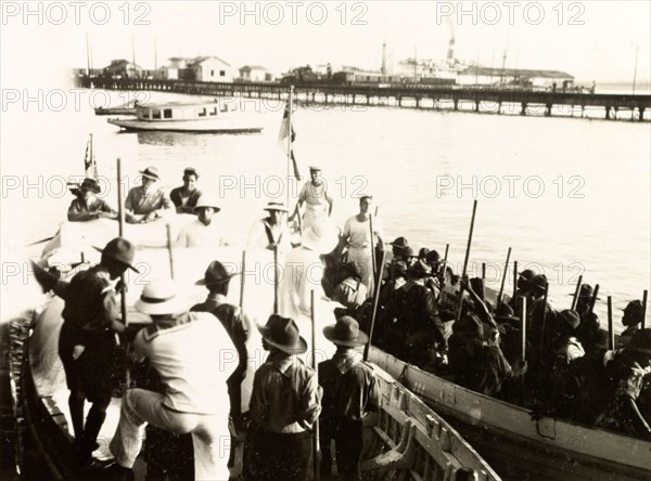 Costa Rican Boy Scouts on a boating trip. A troop of Costa Rican Boy Scouts are taken on a boat trip by British Royal Navy sailors from HMS Dauntless. Limon, Costa Rica, circa 1931. Limon, Limon, Costa Rica, Central America, North America .