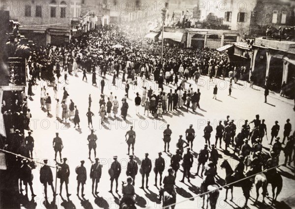 Troubles at Jaffa', 1938. British troops line a town square in Jaffa as an angry procession of Palestinian Arabs marches towards them during the Great Uprising (1936-39). Jaffa, British Mandate of Palestine (Israel), circa 1938. Jaffa, Tel Aviv, Israel, Middle East, Asia.