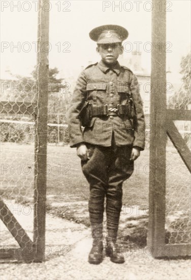 Private James Murray. Full-length portrait of Private James Murray, standing to attention in full military uniform during his first year at Eastbourne College. Eastbourne, England, 1920. Eastbourne, Sussex, England (United Kingdom), Western Europe, Europe .