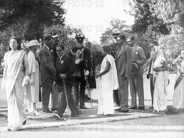 Shaking hands at the Government House Garden Party. Sir Maurice Hallett, Governor of the United Province, and Lady Hallett greet guests introduced by George Boon ADC at the Garden Party at Government House. Lucknow, Utter Pradesh, India. 24 February 1940 Lucknow, Uttar Pradesh, India, Southern Asia, Asia.