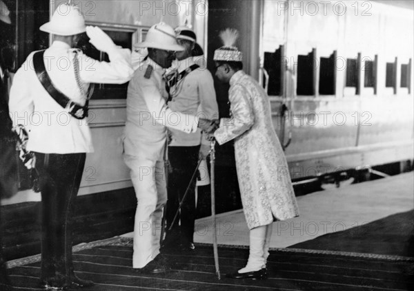 Nawab Station, Rampur. HH The Nawab of Rampur State receives Sir Maurice Hallett, Governor of the United Province, on arrival at Nawab Station, Rampur. Major J Smyth, Military Secretary to the Governor, is standing to the left of Major Smyth and George Boon ADC to the right. Rampur, United Provinces (Uttar Pradesh), India, 10 April 1940, .