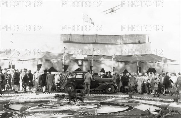 Reception at Jansath. An aircraft flies over guests at a reception at Jansath. Muzaffarnagar, United Povinces (Uttar Pradesh), India, 2 January 1942., Uttar Pradesh, India, Southern Asia, Asia.