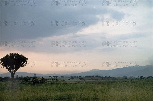 Sunset over Busongora . The sun sets over Busongora in the kingdom of Toro. Busongoro, West Uganda, 1956., West (Uganda), Uganda, Eastern Africa, Africa.