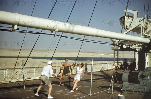 Deck games on the Kenya Castle. Three friends play deck quoits on the Kenya Castle, a passenger liner operated by the Union-Castle line, as it passes through the Suez Canal bound for East Africa. Suez, Egypt, 1958., Suez, Egypt, Northern Africa, Africa.