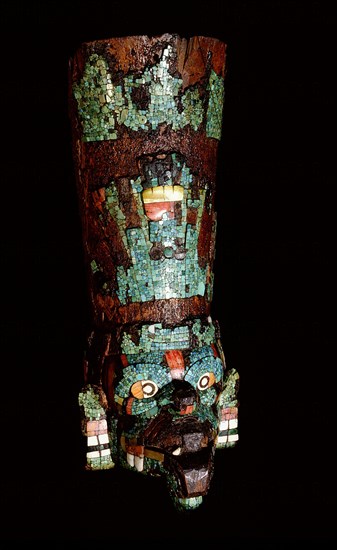 Turquoise mosaic encrusted wood mask representing either the rain god Tlaloc or Quetzalcoatl, the Feathered Serpent, in the form of the wind god Ehecatl