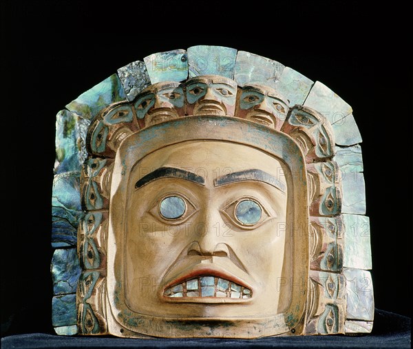 Chiefs frontlets with a human face surrounded by eleven smaller faces and an outer band of abalone shell