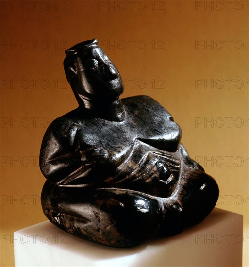 A sitting mother goddess / fertility figure