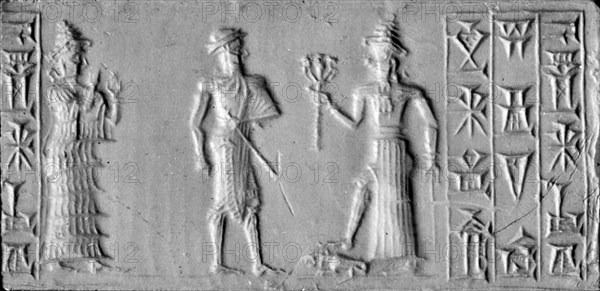 Old Babylonian cylinder seal with depiction of the man with the mace, conventional name for an unidentified possibly divine figure