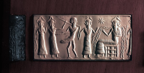 Cylinder seal of the water god Ea with streams flowing from his body