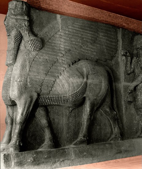 Human headed winged bull and attendant genie from the palace of Sargon II at Khorsabad